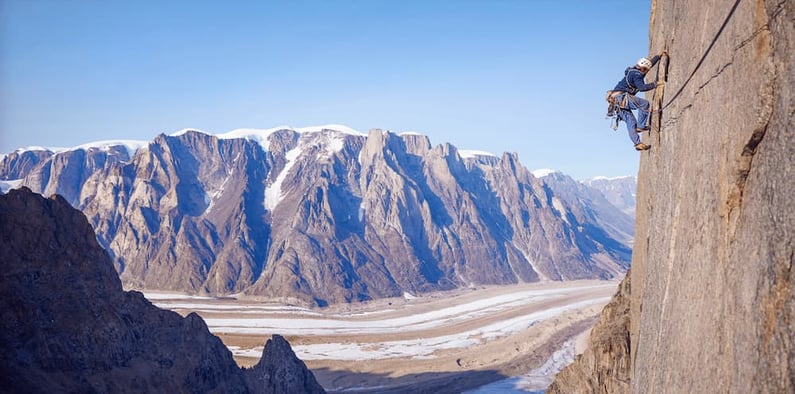 Man climbing a mountain